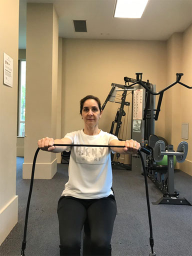 Straight-arm shoulder blade squeeze exercise to minimize Kyphotic curvature