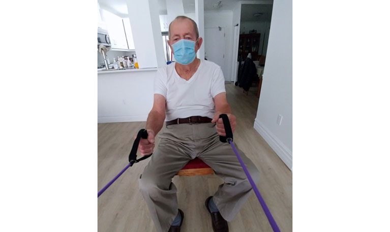 Chester is 83 years old. Here exercising at home