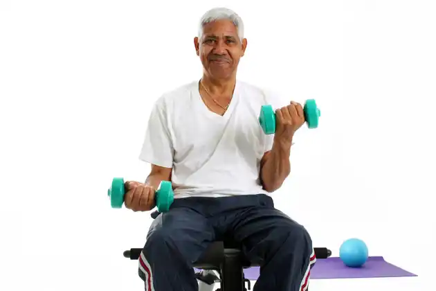 A senior doing weight training