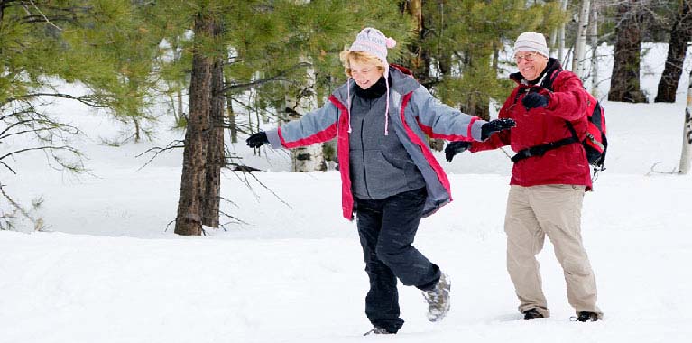 Seniors enjoying a walk on the snow