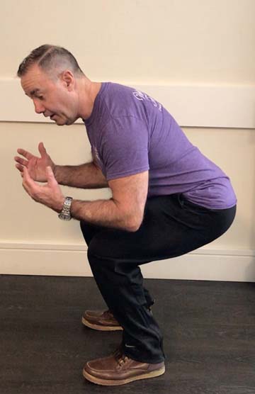 Bill Ross, Personal Trainer in the Southern York Region, demonstrating how to do the squat exercise