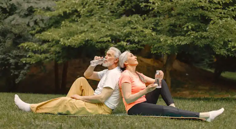 Older couple enjoying a healthy summer activities in the park