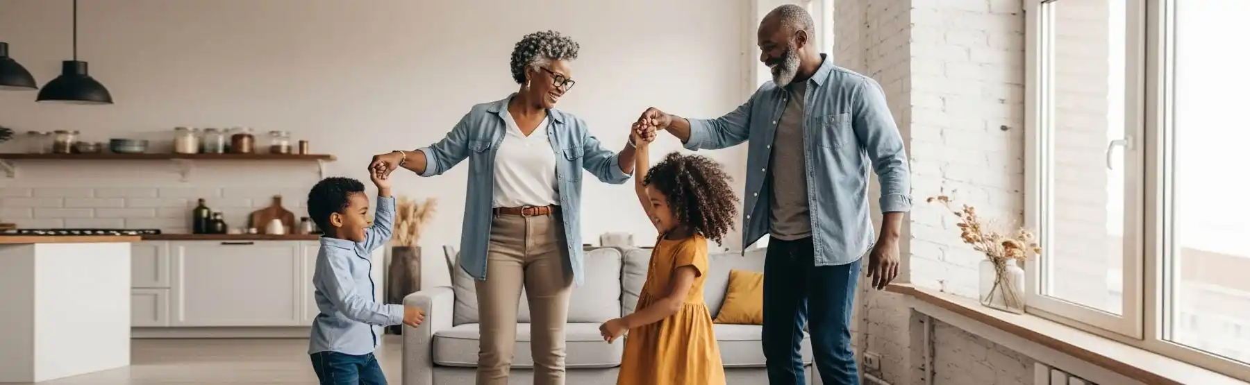 Confident senior couple dancing with grandchildren in their home, enjoying active independent living